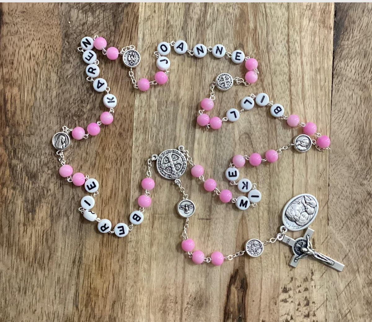 Handmade personalized rosary with family names and crucifix